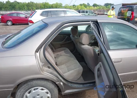 1999 Toyota Camry Le from USA, damaged, VIN 4T1BG22K3XU871911